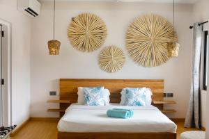 Letto o letti in una camera di Anse Boudin Chalets