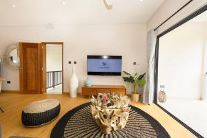 TV o dispositivi per l'intrattenimento presso Anse Boudin Chalets