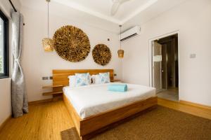 Letto o letti in una camera di Anse Boudin Chalets