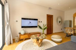 TV o dispositivi per l'intrattenimento presso Anse Boudin Chalets