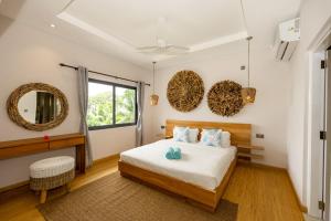 Letto o letti in una camera di Anse Boudin Chalets