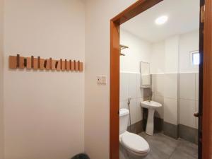 Koupelna v ubytování Shoreline Guesthouse 海岸线客栈
