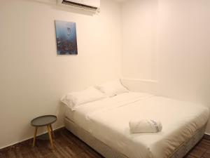 Postel nebo postele na pokoji v ubytování Shoreline Guesthouse 海岸线客栈