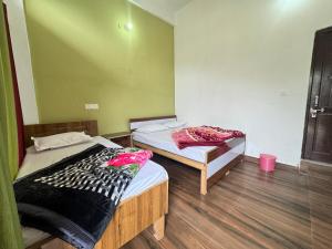 Hotel Rest and Bite客房内的一张或多张床位