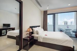 Postelja oz. postelje v sobi nastanitve Dylan Hotel Danang