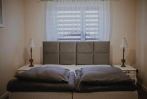 a bedroom with a bed with a large window at Beskidzka Oaza in Targanice