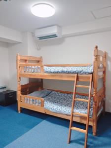 Postel nebo postele na pokoji v ubytování ひまわりHotel