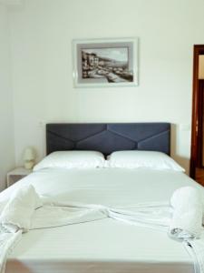 Letto o letti in una camera di Vizion Hotel