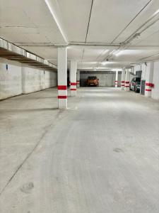 an empty parking garage with cars parked in it at Suites La Catedral in León