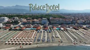 an aerial view of a beach with chairs and umbrellas at Palace Hotel in Viareggio