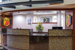 a fast food restaurant with a reception counter at Super 8 by Wyndham Sherwood Park/Edmonton Area in Sherwood Park