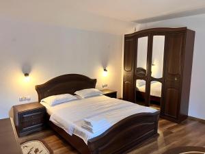 Postel nebo postele na pokoji v ubytování CASA ALEXANDRA