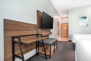 Rúm í herbergi á Comfort Inn Miramar Beach-Destin
