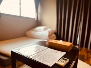 Postel nebo postele na pokoji v ubytování Hostel SAMURISE KURA