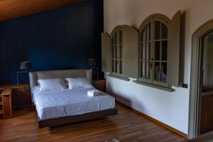 Postel nebo postele na pokoji v ubytování B&B Villa Argiolas