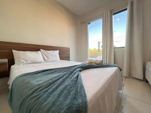 a bedroom with a bed with a stuffed animal on it at POUSADA MEDITERRÂNEO in Lagarto +11 photos