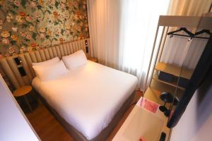 Postel nebo postele na pokoji v ubytování Rosa Hotel