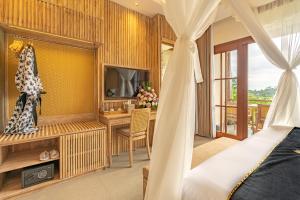 Μια τηλεόραση ή/και κέντρο ψυχαγωγίας στο Bliss Ubud Luxury Villa