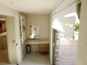 a bathroom with a sink and a mirror at Villa spacieuse, totalement adaptée aux normes PMR in Nice +24 photos