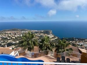 a view of the ocean from the balcony of a resort at Casa Boho in Cumbre del Sol