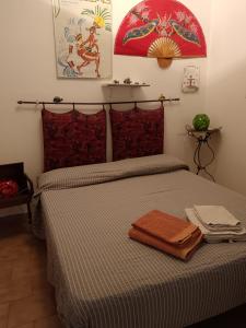 En eller flere senge i et værelse på La casa dell'azzurro + 5 billeder