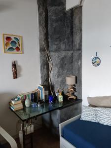 En eller flere senge i et værelse på La casa dell'azzurro