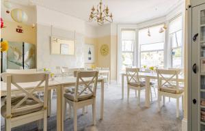a dining room with a table and chairs at St Johns Guest House in Weymouth
