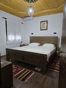 Ένα ή περισσότερα κρεβάτια σε δωμάτιο στο Hazmurat Hotel