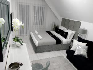 Postel nebo postele na pokoji v ubytování Okuninka Palace + 18 fotografií