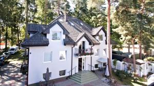 an aerial view of a white house at LC pokoje & apartamenty in Pobierowo