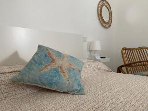 Postel nebo postele na pokoji v ubytování Gemma Mediterranea