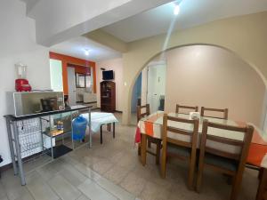 a living room with a table and a dining room at Casa Magro depto para 6 in Oaxaca City +25 photos