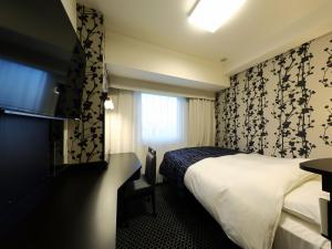 Voodi või voodid majutusasutuse APA Hotel Ueno Inaricho Ekikita toas