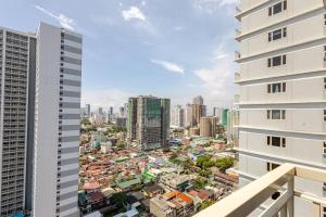 a view of the city from the balcony of a building at J5 Bayview Elegant Retreat with Stunning Views Free WiFi in Manila