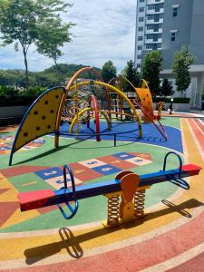 a childrens play park with a playground at Tiny Sweet Home in Kajang