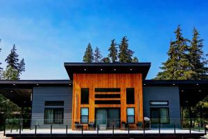 a house with a black and orange at LuxQuarters Blueberry Studio in Kitimat