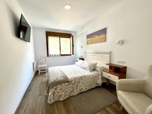 Łóżko lub łóżka w pokoju w obiekcie Apartamento Valbuena