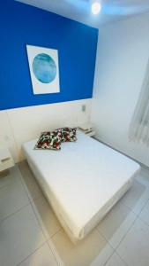 Cama ou camas em um quarto em Apartamento com varanda Gourmet na praia da enseada