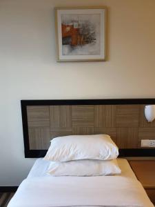 Postel nebo postele na pokoji v ubytování Easy Cozy Simple Room Genting Highlands