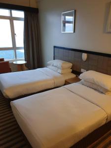 Postel nebo postele na pokoji v ubytování Easy Cozy Simple Room Genting Highlands