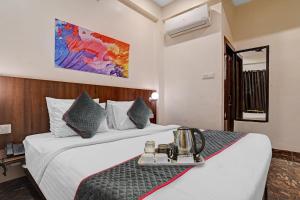 Townhouse Hotel O Benchmark客房内的一张或多张床位