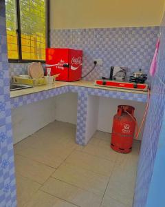 a toy kitchen with a table and a fire hydrant at paje zanzibar apartment in Paje