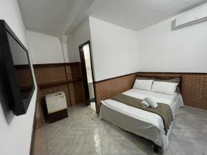 Postel nebo postele na pokoji v ubytování Pousada Vila Nova