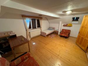 an overhead view of a living room with a wooden floor at Vacation House Lunca Bradului in Lunca Bradului