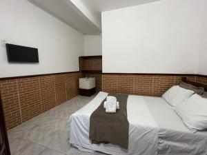 Postel nebo postele na pokoji v ubytování Pousada Vila Nova