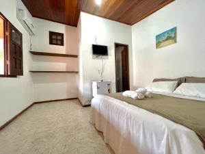 Postel nebo postele na pokoji v ubytování Pousada Vila Nova