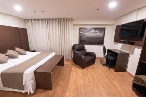 TV a/nebo společenská místnost v ubytování Olavo Bilac Hotel