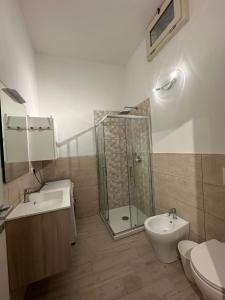 a bathroom with a shower and a toilet and a sink at L'Angolo Rosa in Casale Monferrato +13 photos