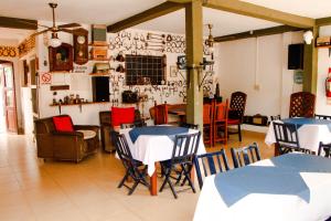 a dining room with two tables and chairs at Hostal San Jorge in Cafayate
