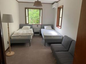Postel nebo postele na pokoji v ubytování Guesthouse SÁPMI